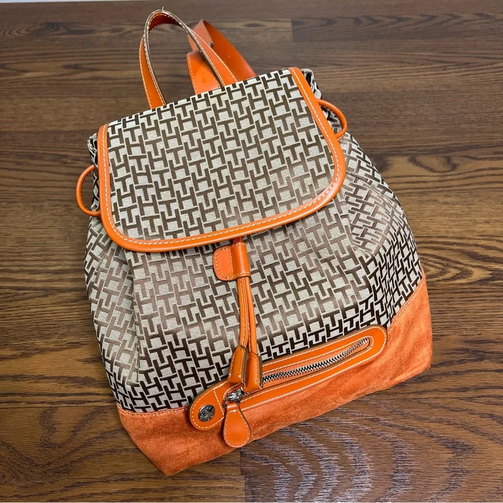 Tommy Hilfiger backpack in orange and brown with a monogram logo print